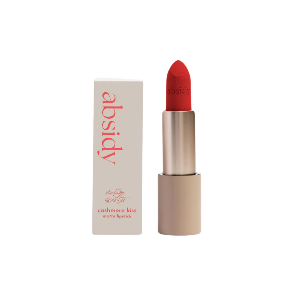 Red lipstick in a beige tube beside a light box with the brand name Absidy and text 'Vintage Scarlet Cashemere Kiss Matte Lipstick'.