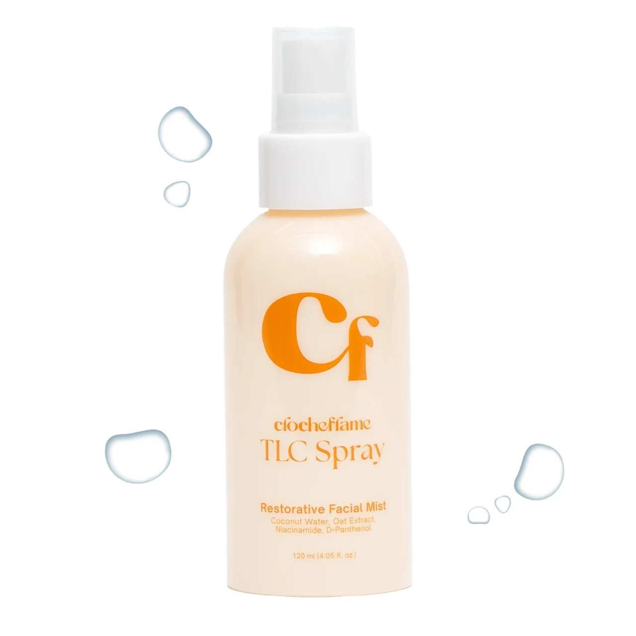 Close-up of a spray bottle labeled Restorative Facial Mist with droplets around the nozzle.