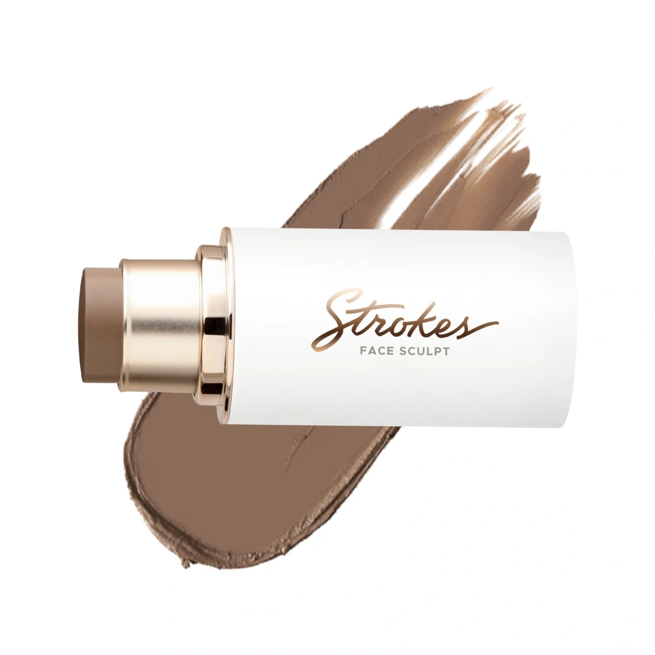 Cosmetic makeup tube with a gold cap and a broad brown foundation swatch brushed behind it.